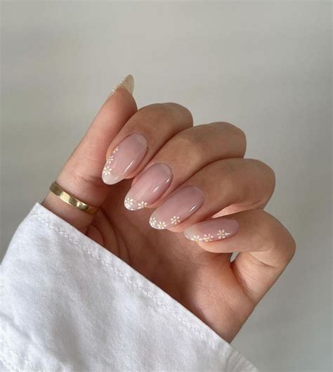 Gel x nails inspo - Instagram. We've got a sweet tooth for this nude set that resembles a chocolate and vanilla swirl ice cream cone. A simple neutral-colored manicure with brown and white swirls, the look is chic and super trendy. This design is fantastic on almond-shaped and round nails, but square nails can rock it too.